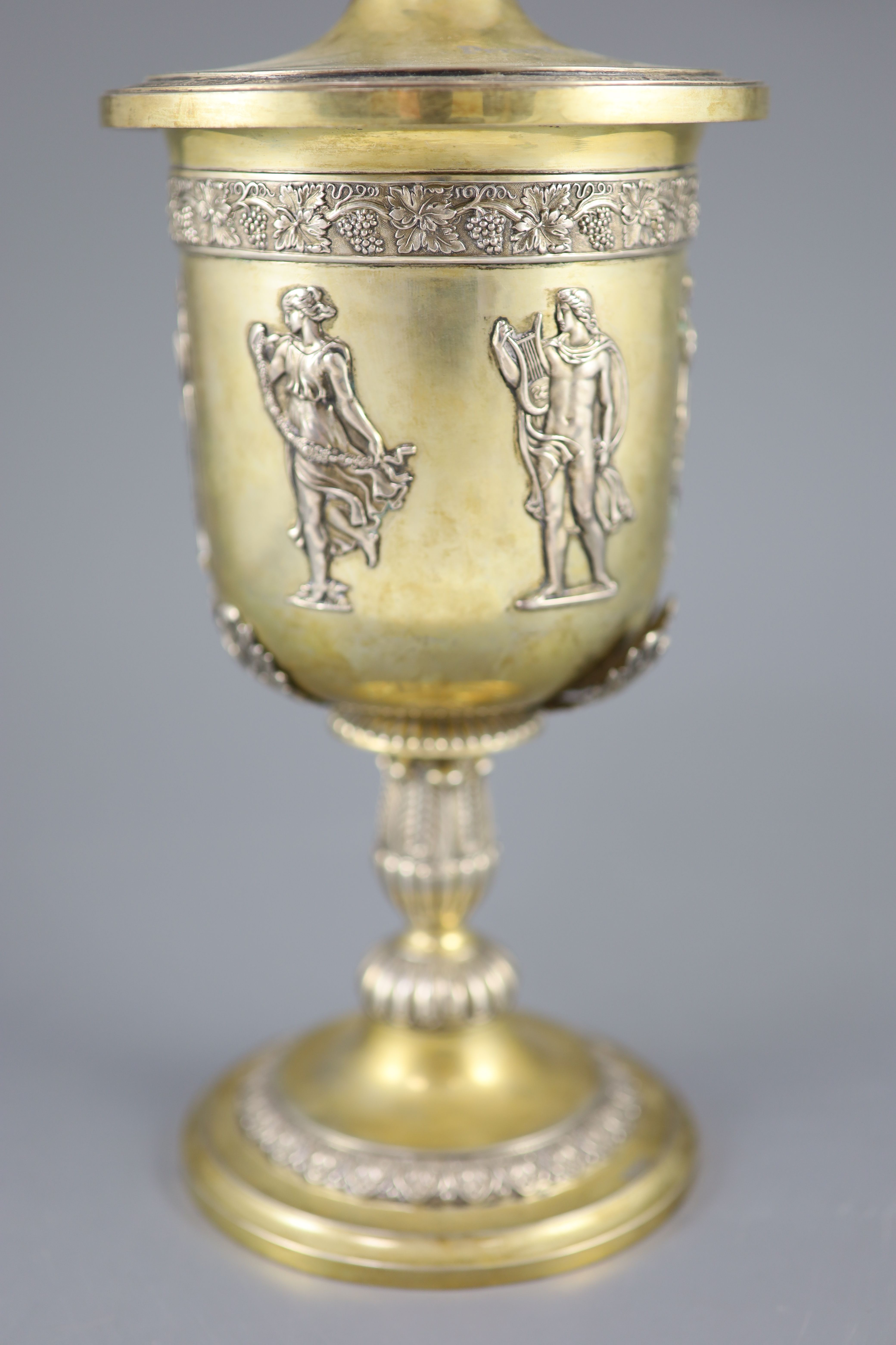 A late 19th/early 20th century German parcel gilt 800 standard presentation pedestal cup and cover, by Wollenweber,